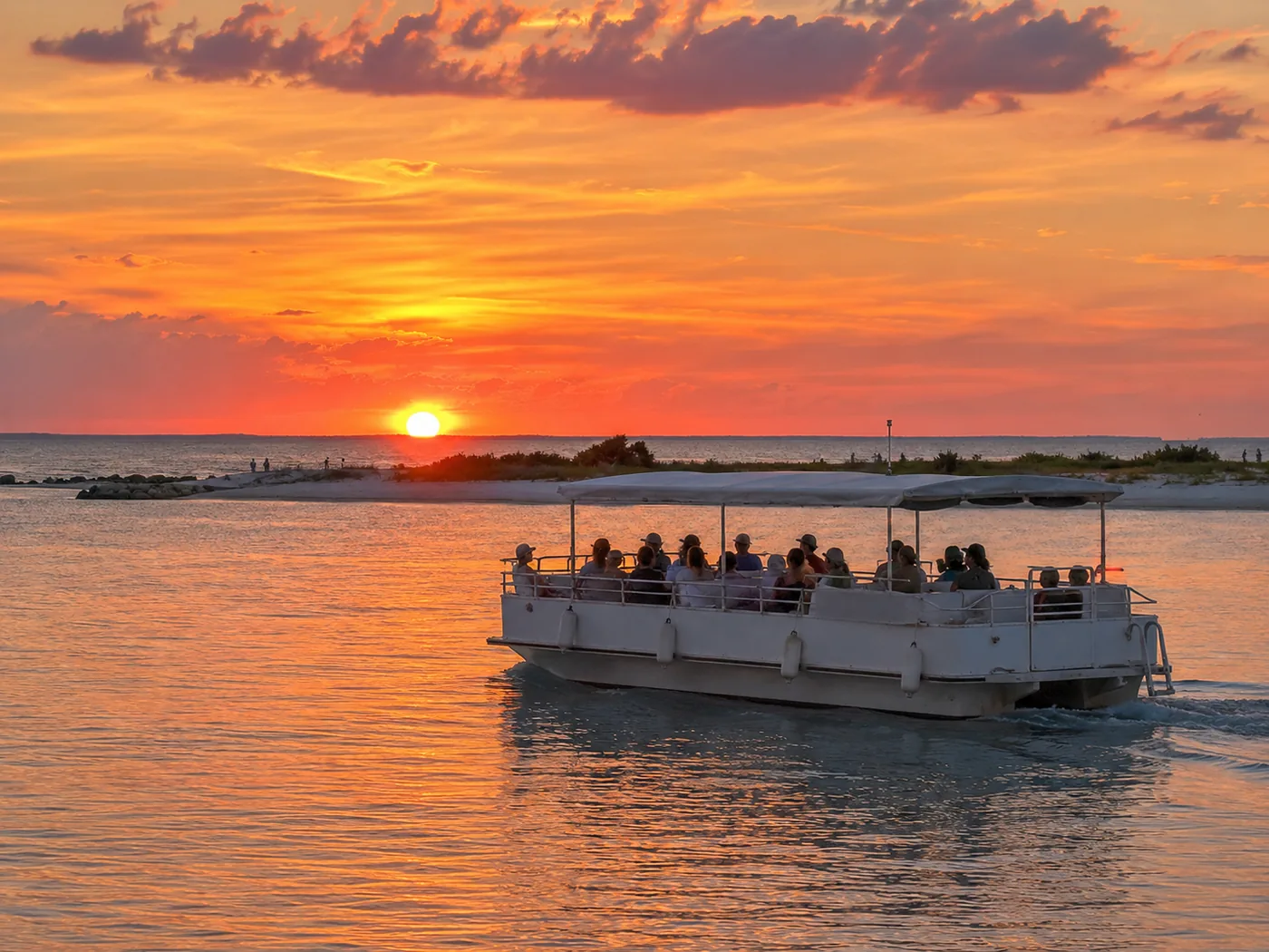 Sunset boat departing from Holmes Beach on the Gulf side of Anna Maria Island
